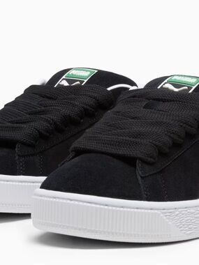 Puma Black Suede Low-Top Sneakers with White Sole and Green Tongue Tag